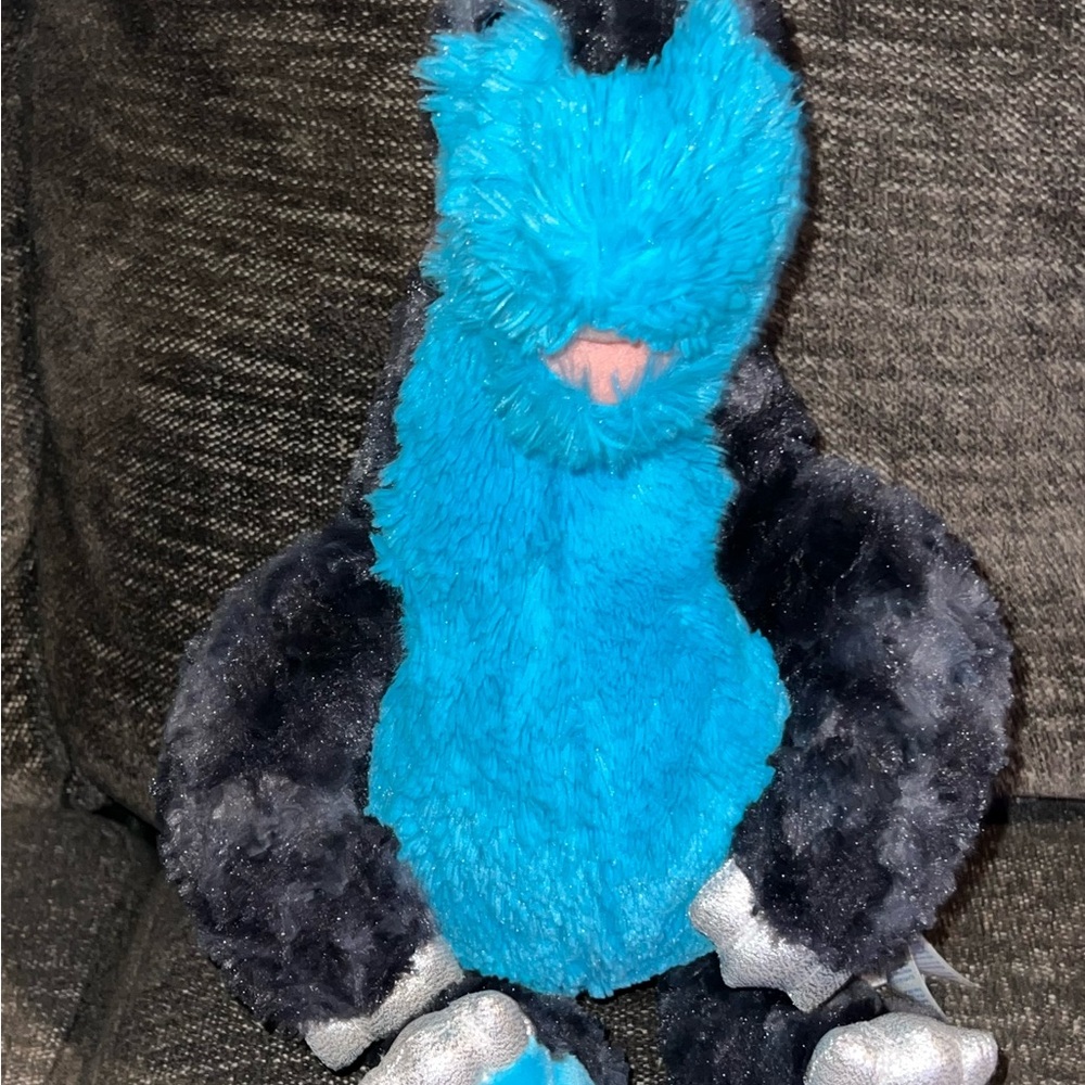 This is a retired Build-A-Bear Stegosaurus plush stuffed animal